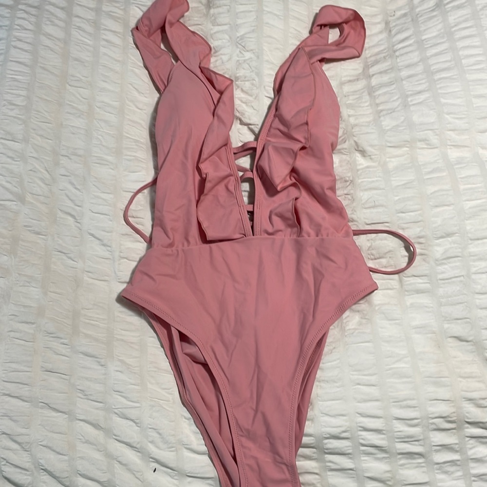 Never worn sexy one piece bathing suit